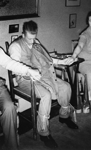 Jack Webber tied to a chair